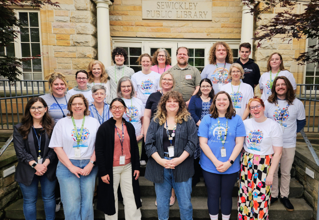 Library staff standing on the steps on the Thorn Street entrace to the library