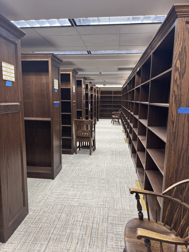 View of non-fiction stacks with new carpet and no books on shelves