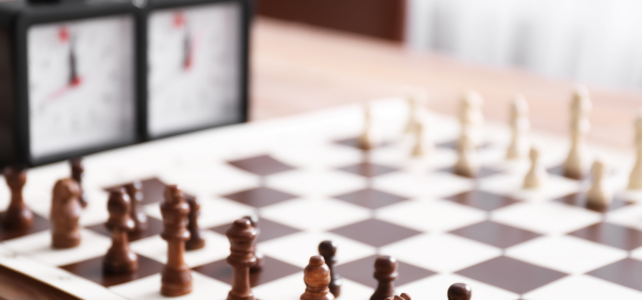 Do You Have What It Takes? Chess board on a table with timers