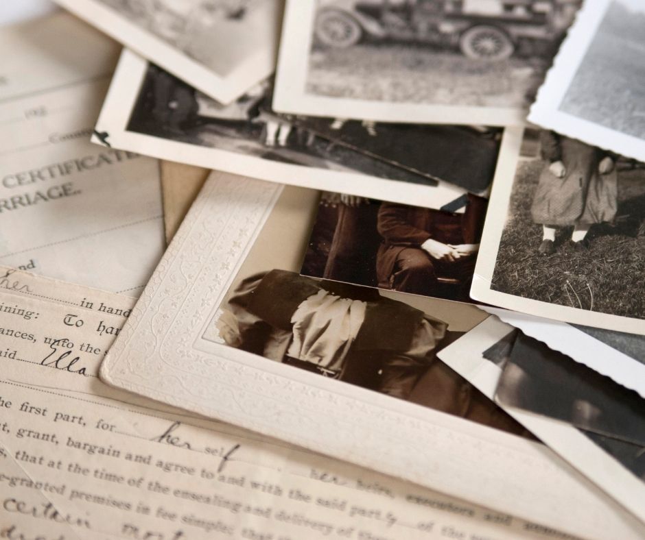 Old photographs and family documents in a pile